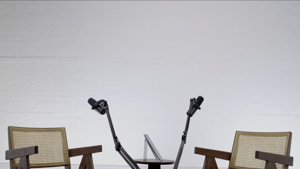 Outset Studio London Bridge set up with 2 arm chairs, microphones and coffee table